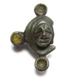 Romano-British Face Brooch. Circa 1st-2nd century AD. Copper-alloy, 6.28 grams. 36.66 mm. A very