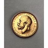 A George V Sovereign, 1911 Condition, wear to high points with small scratches to surface.