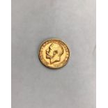 George V, 1912 Sovereign. Condition, wear to high points with small scratches to surface.