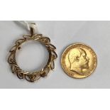 An Edward VII 1906 22ct gold half sovereign, mounted in a 9ct gold Art Nouveau pendant, 6.43 grams