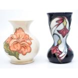 Moorcroft: 2  Moorcroft floral vases to include 'Hibiscus' pattern plus one other. Heights approx