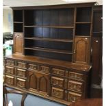 An early 18th Century joined oak dresser base and a later rack, base of circa 1710, fitted with