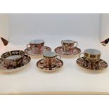 A collection of five various Royal Crown Derby Imari tea or coffee cup and saucer examples to
