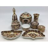 A collection of Royal Crown Derby Imari ware to include: 1. circular pill box and cover, pattern no