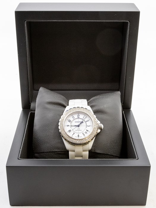 Chanel - a ladies white ceramic J12 Automatic wristwatch, the circular white dial with black