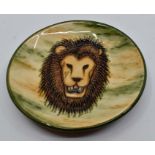 A Moorcroft Lion Head coaster designed by Anji Davenport, date trial 9/12/99, 12cm diam, with box