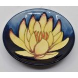 A Moorcroft May Lily coaster designed by Emma Bossons for Moorcroft Collector's Club, date 2001,