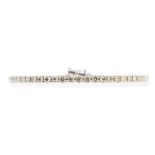 A diamond set 18ct white gold tennis bracelet, the bracelet claw set with fifty-eight brilliant