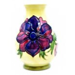 Moorcroft: A Moorcroft 'Anemone' pattern vase on yellow ground. Height approx 13.5cm. Marks to base.