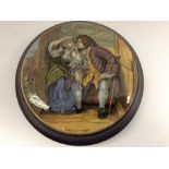 A Prattware pot lid cover titled Uncle Toby, depicting Uncle Toby and Widow Wadman in a sentry