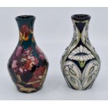 Moorcroft: 2 contemporary Moorcroft floral pattern vases. Height approx 13cm. Marks to the bases.