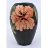 Moorcroft: A Moorcroft ' Coral Hibiscus' olive vase. Height approx 18cm. Marks to base. Condition: