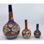 Three Asian onion shaped vases of graduating sizes, Imari and Satsuma (3)