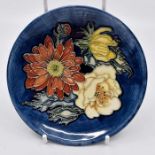 A Moorcroft Victoriana coaster designed by Emma Bossons, date September (19) 97, shape no 780/4,