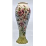 Moorcroft: A Moorcroft 'Spring Blossoms' baluster vase. Height approx 27cm. Marks to base.