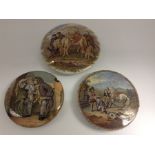 A collection of three Prattware pot lid covers to include: Chief's Return from Deer Stalking after