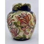 Moorcroft: A Moorcroft trial ginger jar 'Honeysuckle' pattern. Height approx 15.5cm. Marks to the