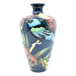 Moorcroft: A Moorcroft Bird & Butterfly vase. Height approx 16cm. Marks to base. Condition: No