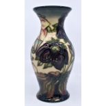 Moorcroft: A Moorcroft 'Ashwood Hellebore' waisted vase. Height approx 19.5cm. Marks to base.