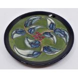 A Moorcroft Holly large coaster designed by Rachel Bishop, training piece dated 1998, 16cm diam