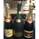 A bottle of Remy Martin Fine Champagne, a bottle of Louis De Belmance special reserve and a bottle
