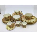 A collection of Royal Worcester blush ivory, floral decoration, to include a miniature cup and