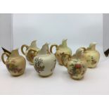 A collection of Royal Worcester blush ivory to include six amphora shaped jugs various sizes,