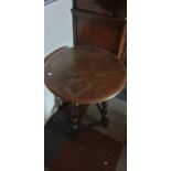 ****** ITEM LOCATION BISHTON HALL********** A 20th Century oak circular occasional table, raised