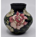 Moorcroft: A Moorcroft 2008 Collectors Club vase. Height approx 8cm. Marks to the base. With box.