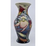 Moorcroft: A Moorcroft 'Queens Choice' pattern vase by Emma Bossons. Height approx 20cm. Marks to