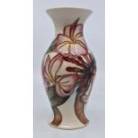 Moorcroft: A Moorcroft 'Frangipani' pattern baluster vase. Height approx 19.5cm. Marks to the