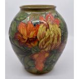 A Moorcroft Flame of the Forrest vase designed by Philip Gibson, date 1999, 23cm high  Condition