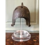 ****** ITEM LOCATION BISHTON HALL********** A Chinese funerary helmet, Zhou Dynasty, height 30cm, on