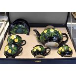 Moorcroft: A Moorcroft teaset for collectors in original fitted box. 'Buttercup' pattern. Condition: