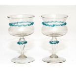 A pair of facon de Venise wine glasses with blue can decoration, possibly Venice circa 1700,