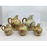 A collection of Royal Worcester blush ivory to include five amphora shaped jugs various sizes,