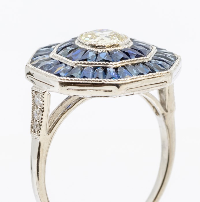 An Art Deco style sapphire and diamond platinum set cocktail ring, comprising a central rub-over set - Image 2 of 3