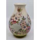 A Moorcroft Spring Blossom vase designed by Sally Tuffin, date 1990, 20cm high, boxed Condition