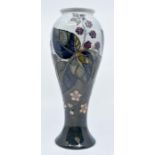 Moorcroft: A Moorcroft 'Bramble' baluster shaped vase. Height approx 27.5cm. Marks to base.