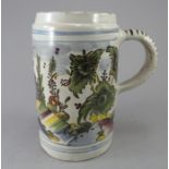 A large eighteenth century tinglazed earthenware, possibly German faience, Thuringia, tankard, c.