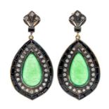 A pair of silver gilt jade and onyx drop earrings, comprising pear cut jade cabochons set to the