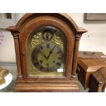 A German oak cased quarter chime mantel clock, stamped on mechanism by Gustav Becker