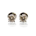 A pair of diamond and 18ct white gold studs, the four claw set, round brilliant cut diamonds