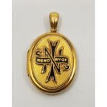 A Victorian precious yellow metal and black enamel oval mourning pendant locket, height exc. bail