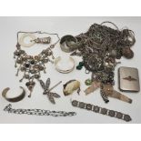 A large collection of silver and white metal jewellery, to include, a white metal "rabbit" baby