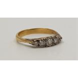 An antique precious yellow metal five stone diamond ring, set five graduated old cut diamonds (