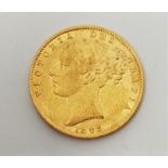 An 1862 Victoria "Young head" gold sovereign, rev. shield.