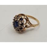 A 9ct. gold, blue and clear stone cluster ring, (gross weight 4.4g) Ring size: UK P