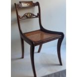 A set of six Regency chairs  with brass inlaid decoration raised on outswept sabre legs(6)