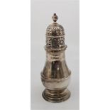 A silver baluster form sugar caster, by Tessiers Ltd, assayed London 1924, height 17.8cm. (234.5g)